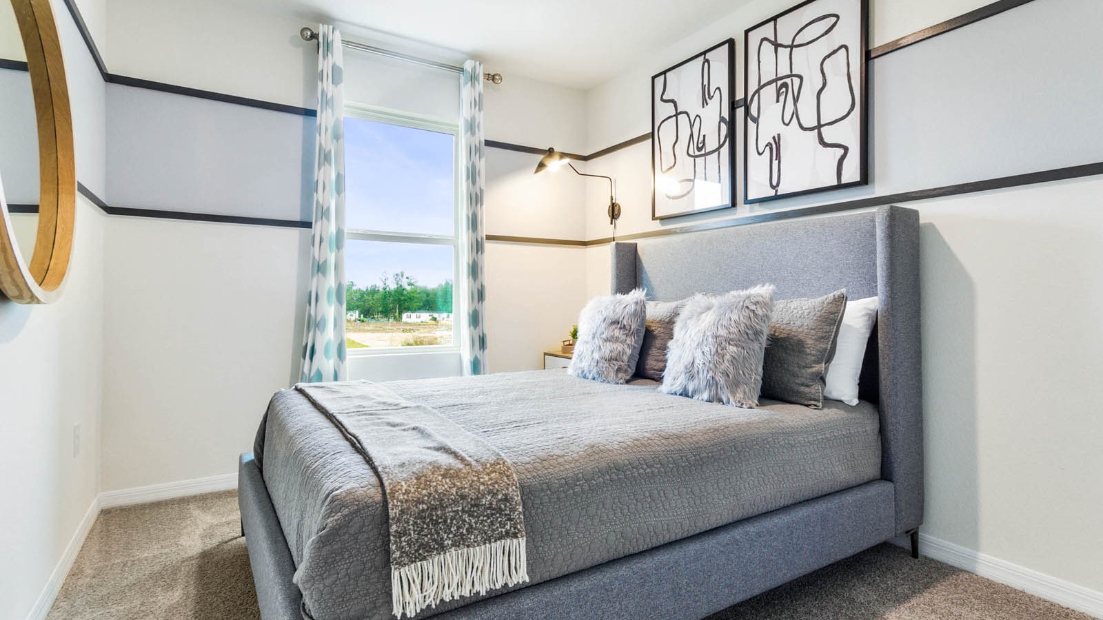 Guest bedroom with bed, nightstands, and a roomy closet for storage.