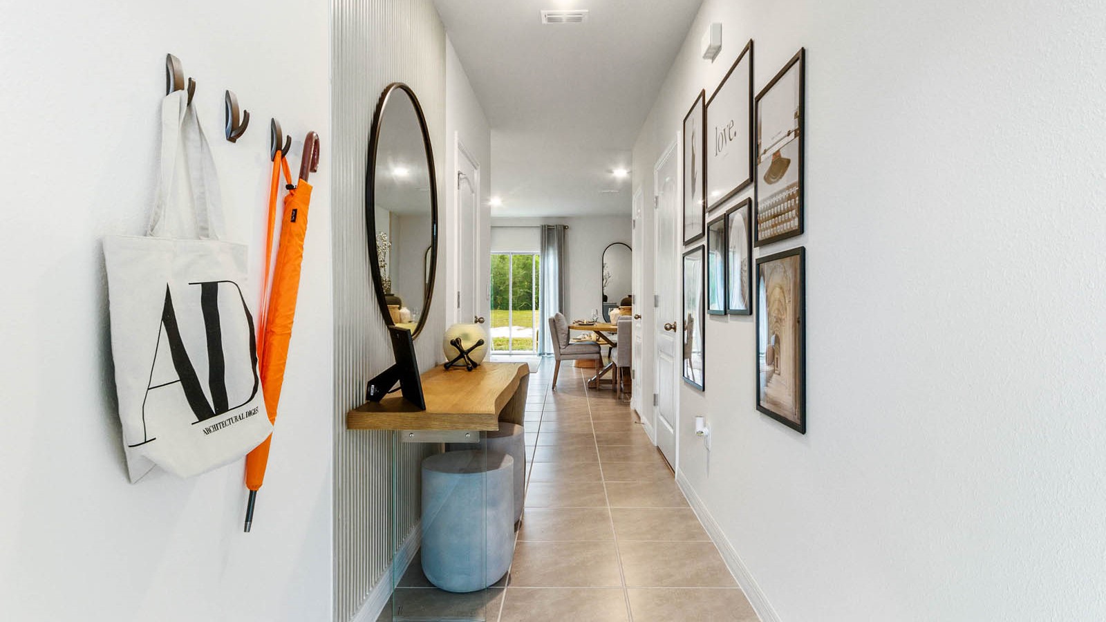 Home entry way thru the front door with tile flooring and a view to the living space.