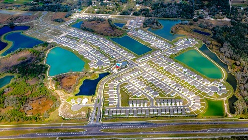 Aerial view of entire Northwater at Two Rivers, including cabana, pool, club house, ping-pong, kids tot lot, cornhole
