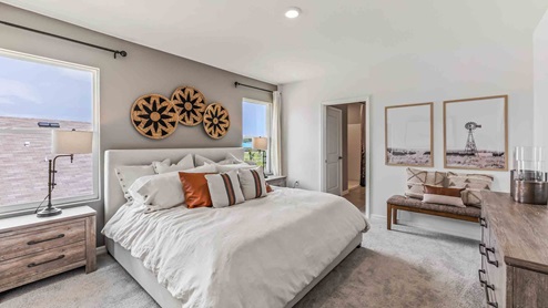 Owner’s suite offers natural window light, spa-inspired ensuite bathroom, backyard view, walk-in closet for everyday style
