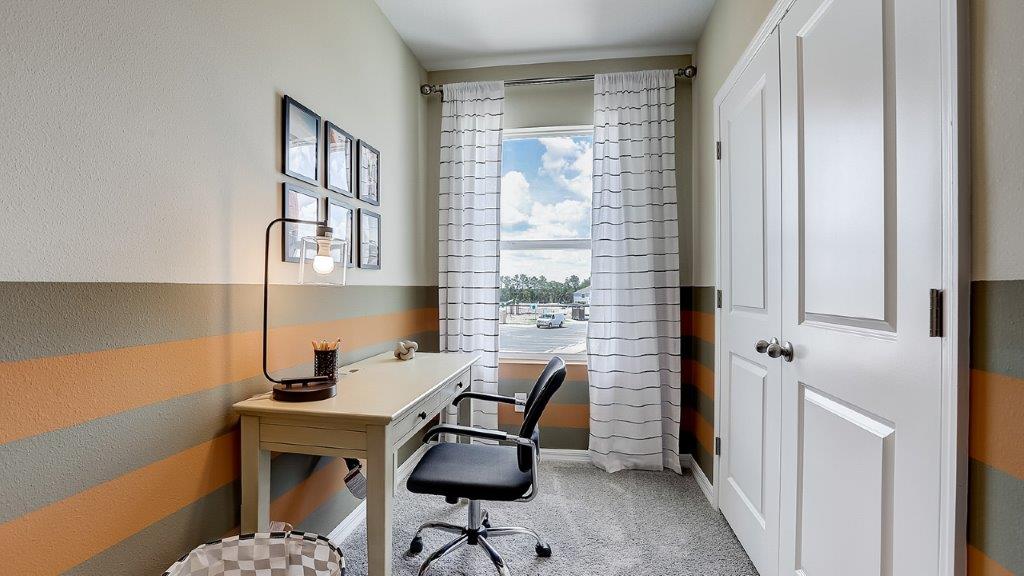 Functional home office with desk, chairs and space to work or play.