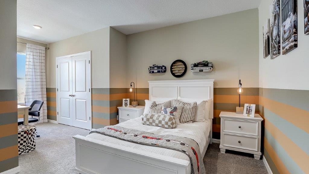Guest bedroom with bed, nightstands, and a roomy closet for storage.