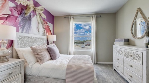 Guest bedroom with bed, nightstands and a roomy closet for storage.