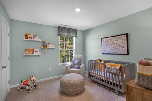 additional bedroom with window, carpeting, closet