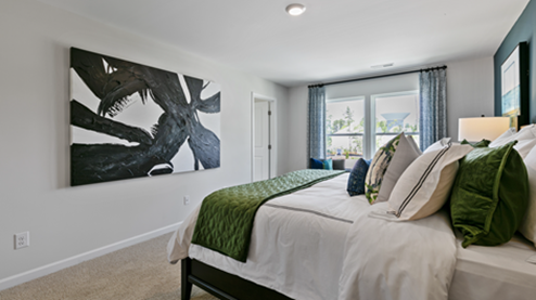 bedroom featuring green and blue decor with a large window
