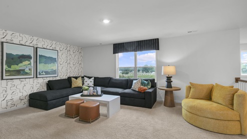 upstairs loft area with large windows and carpeting