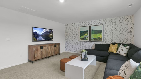 upstairs loft area with large windows and carpeting