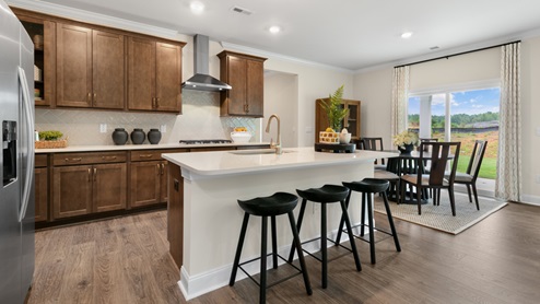Norman Model Kitchen with Brown Cabinets and Quartz Countertops