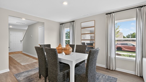 open concept dining space with sliding glass door to patio