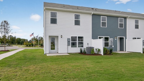 exterior patio with concrete slab and open yard