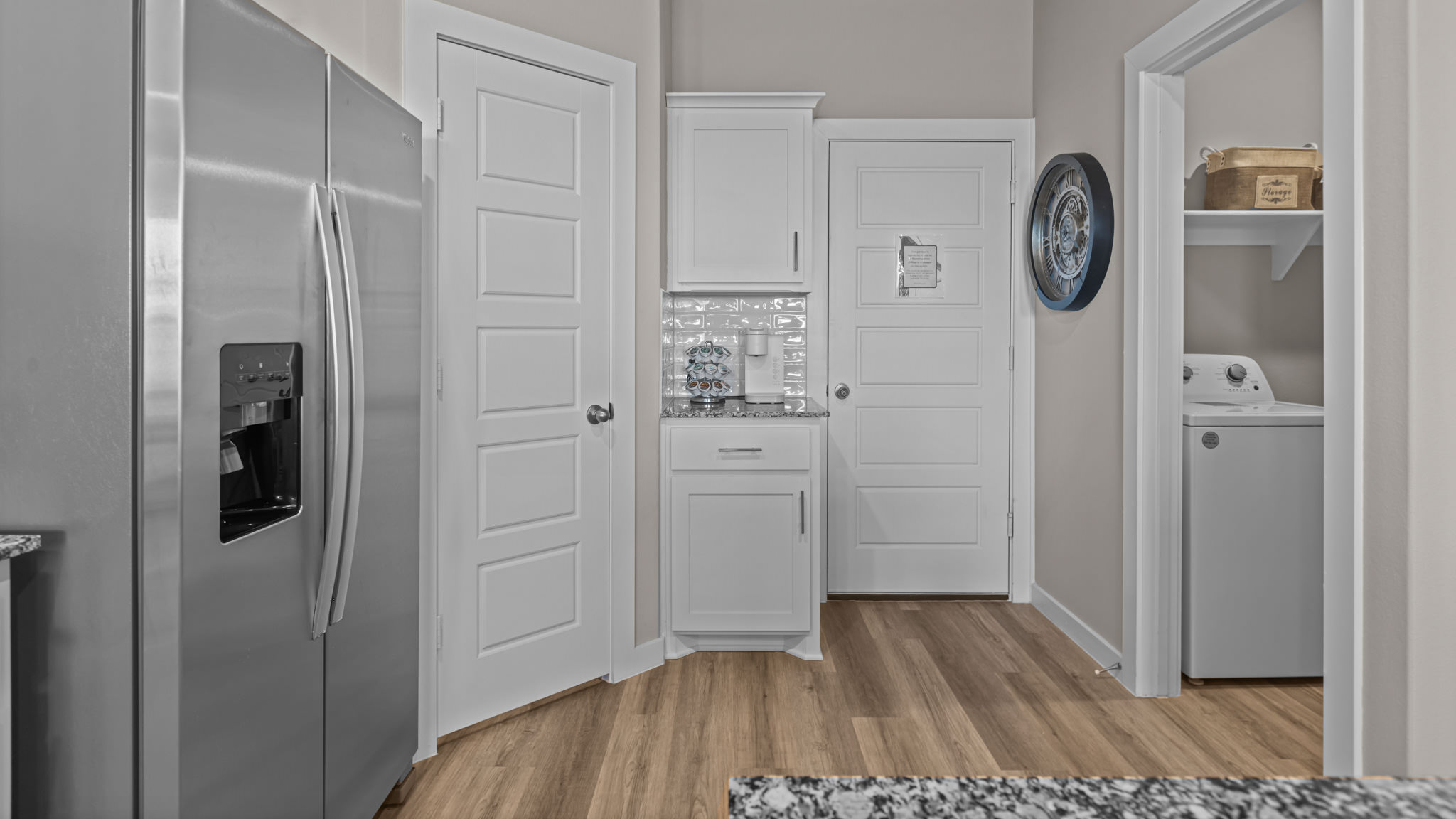 Laundry room and utility closet space with extra storage