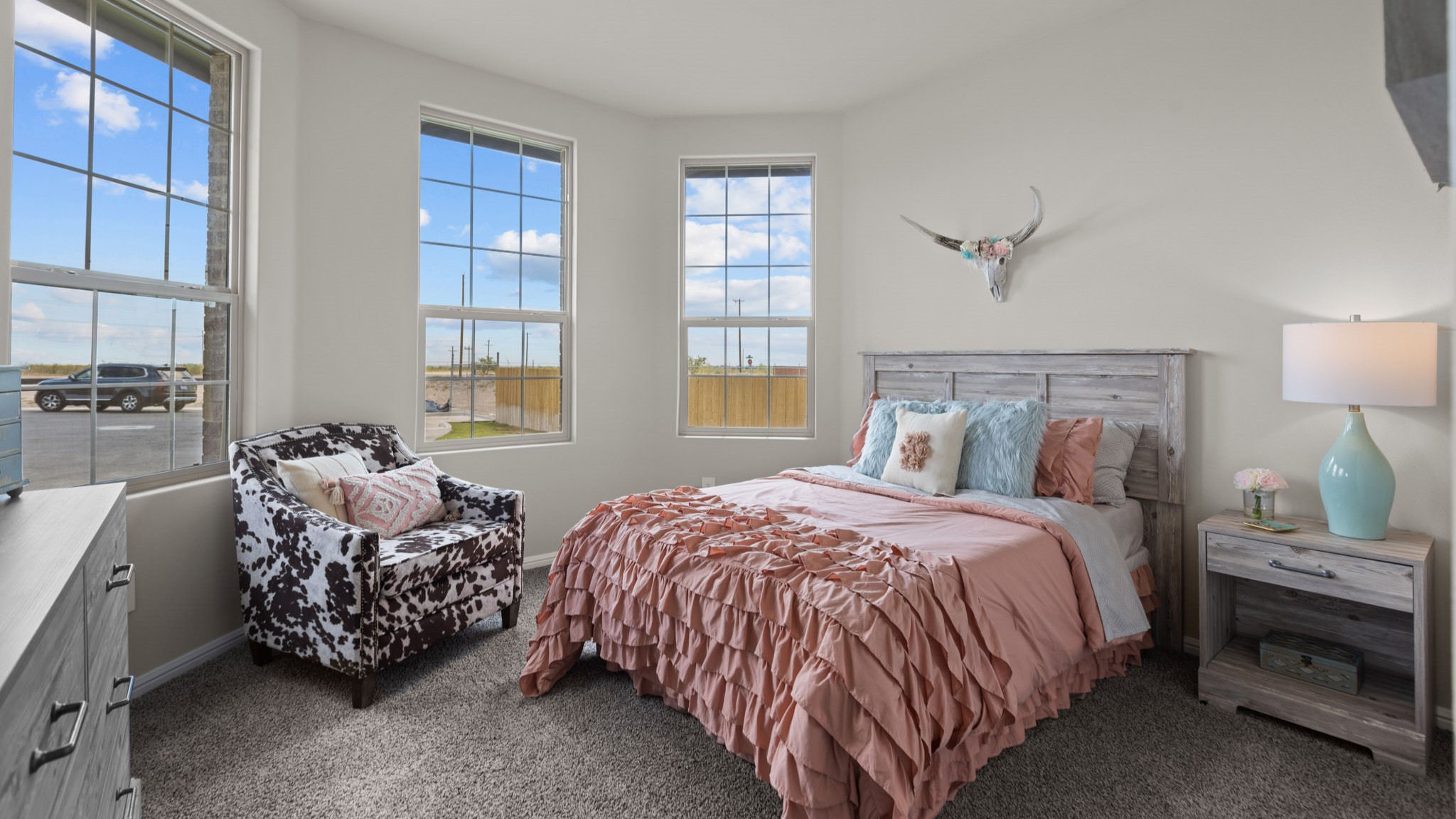 Guest bedroom 1 with front windows and ample natural light