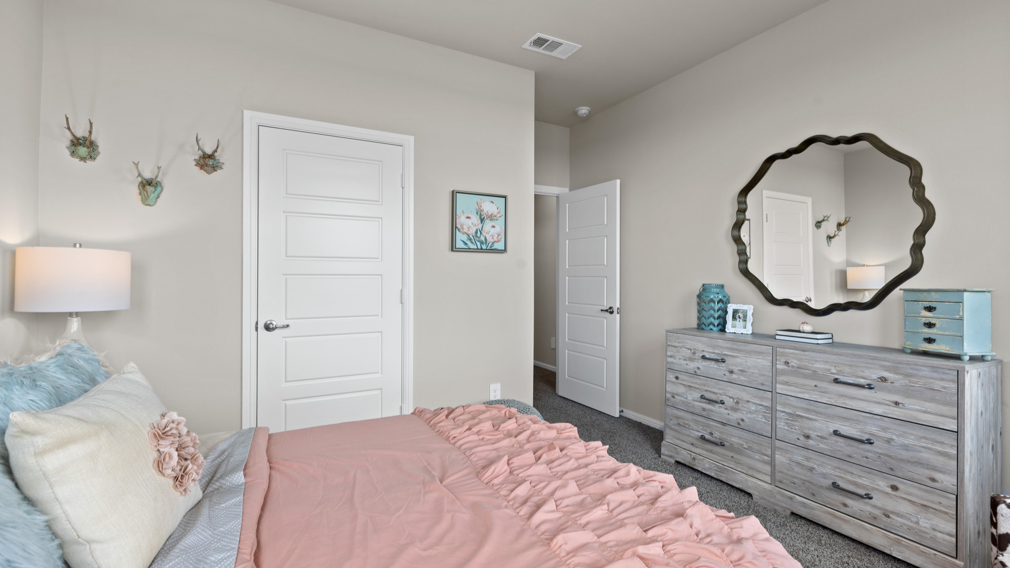 Guest bedroom 1 with front windows and ample natural light