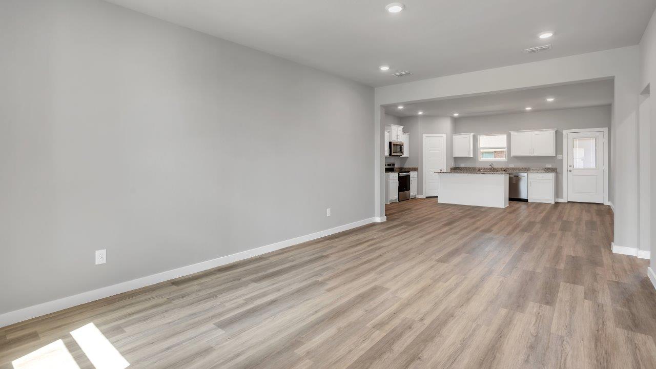 Open concept family, dining, and kitchen space