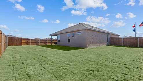 Oversized backyard space with grass