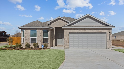 Exterior of single-story modern light brick home with spacious front room and unique bow window