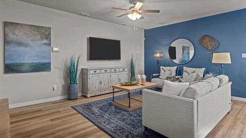 Open concept living space with blue accent colors