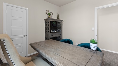 Guest bedroom designed as an office with plush carpet and designed as an office