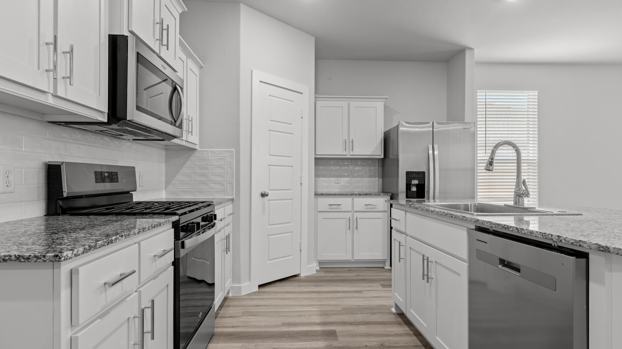 Spacious open kitchen overlooking family and living space