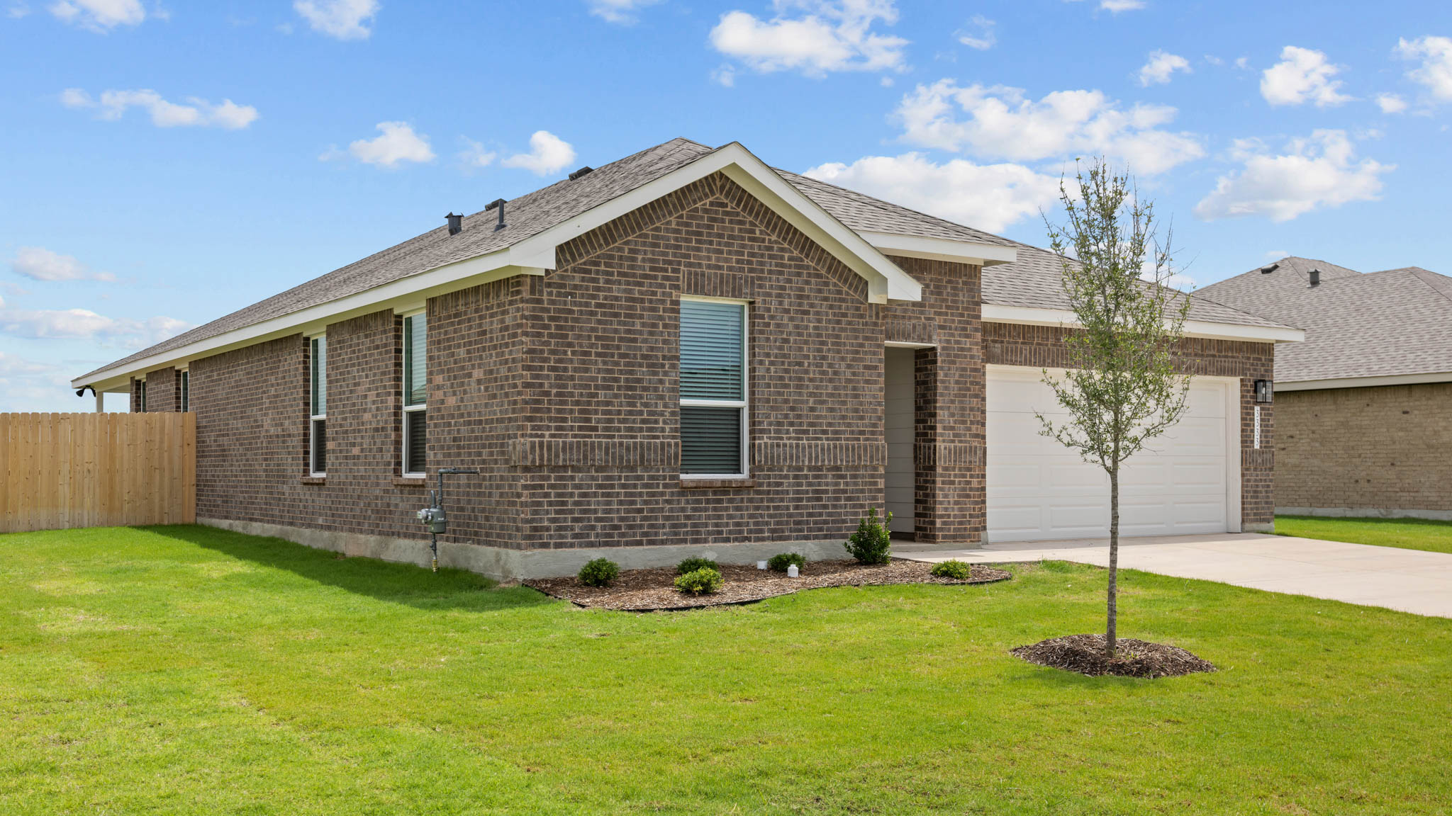 Single story classic brick home with front entry
