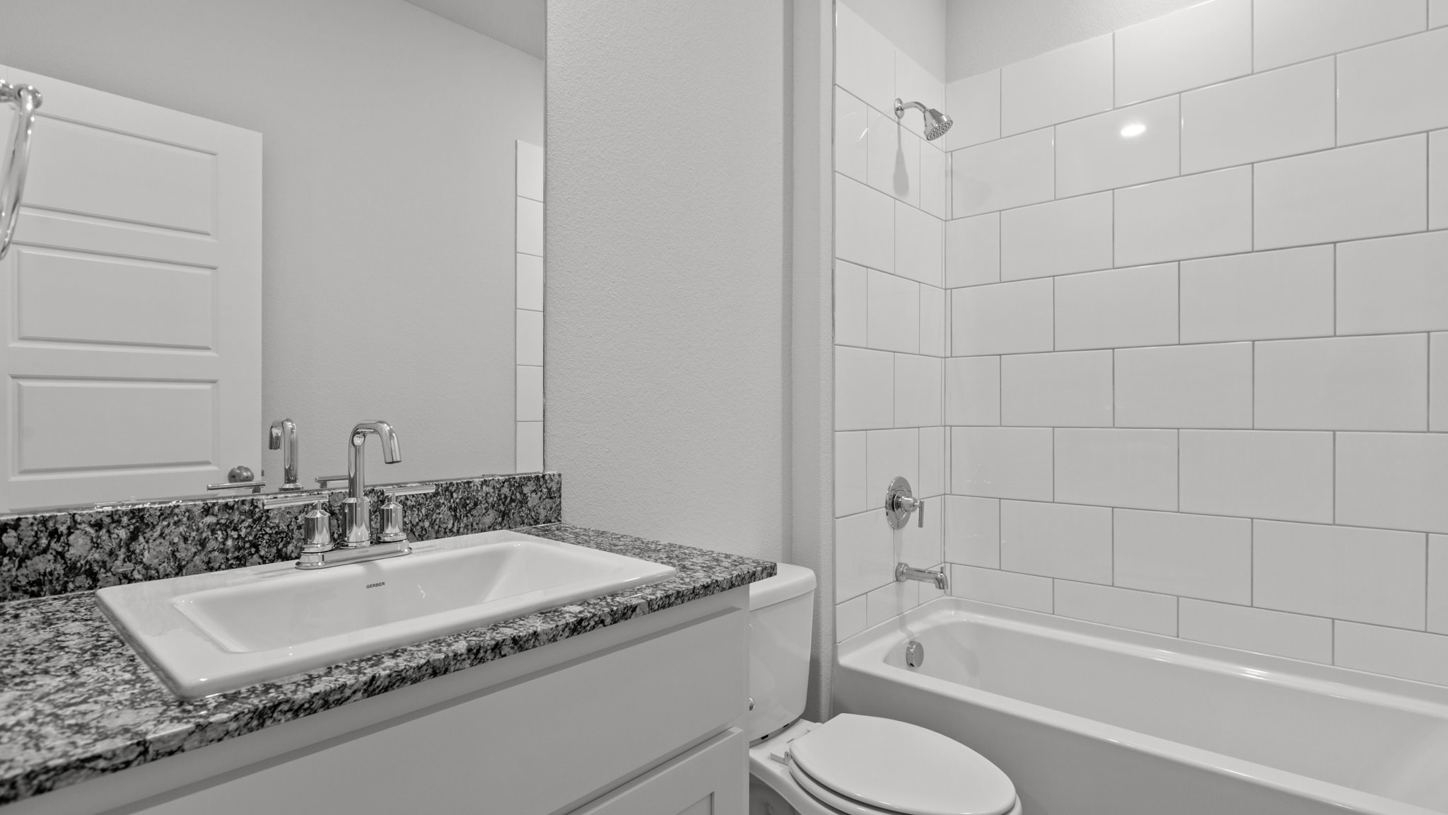 Guest bathroom located between guest bedrooms