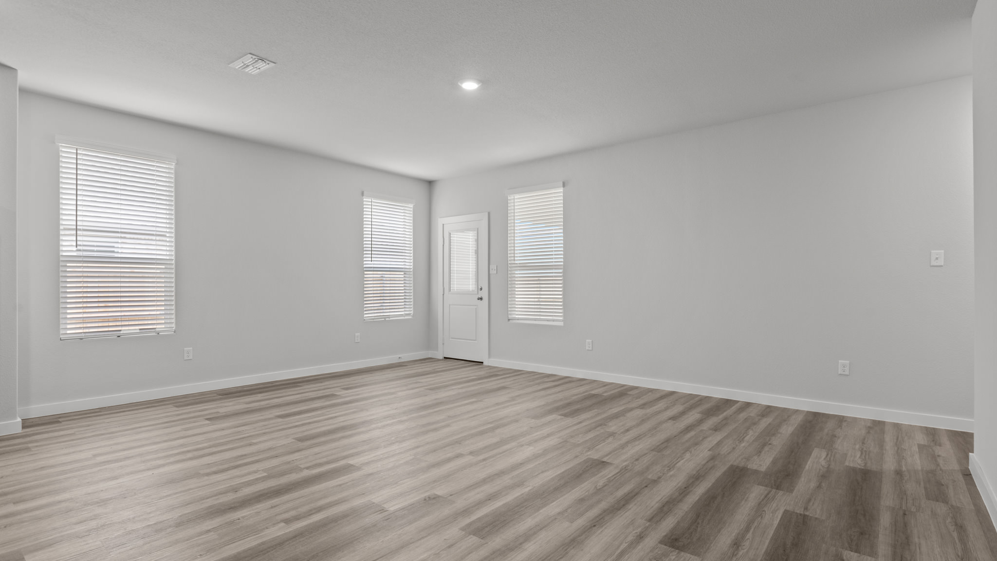 Open living and family room area with ample natural light