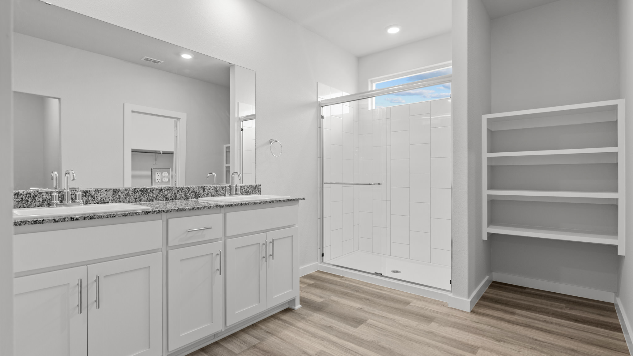 Private attached primary bathroom with built in vanity