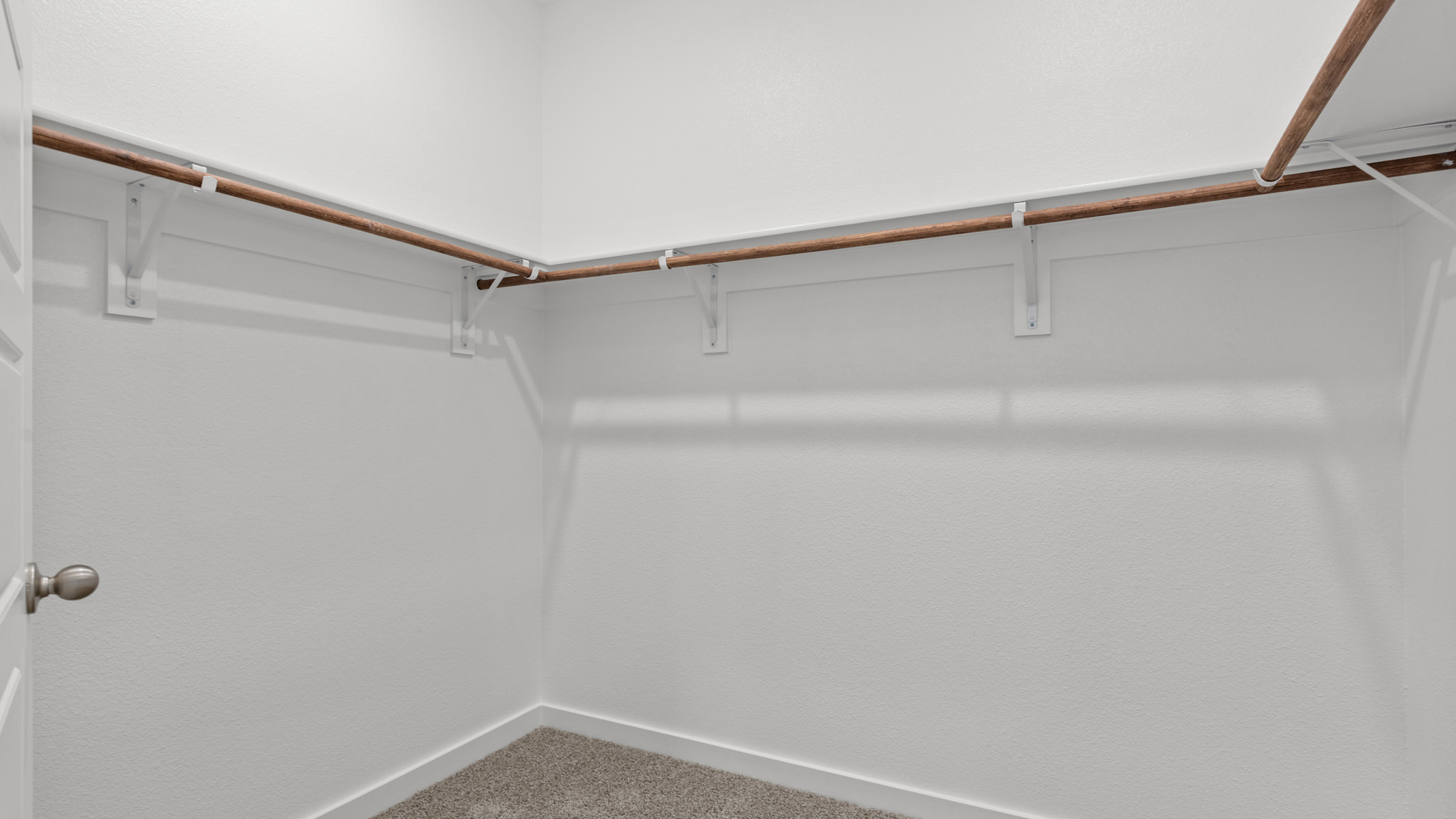 Primary walk-in closet with extra storage space