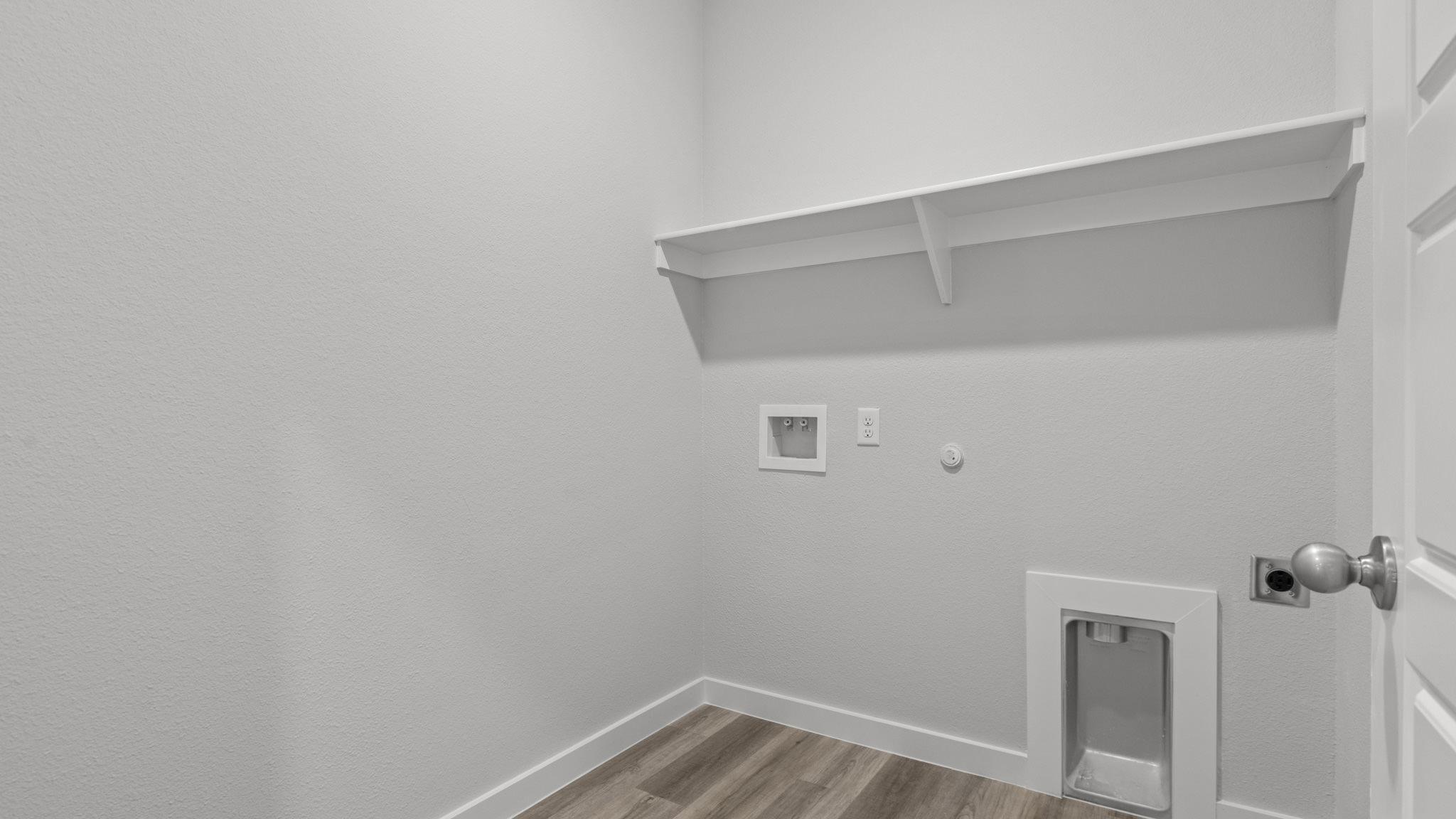 Laundry room and utility closet space with extra storage