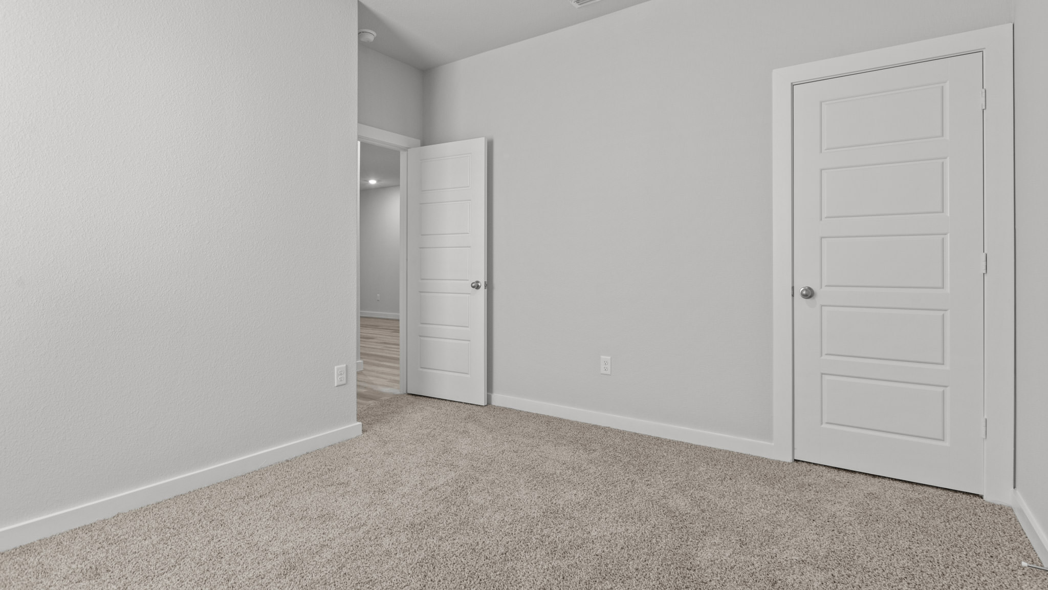 Guest bedroom 3 with plush carpet floors and spacious closet