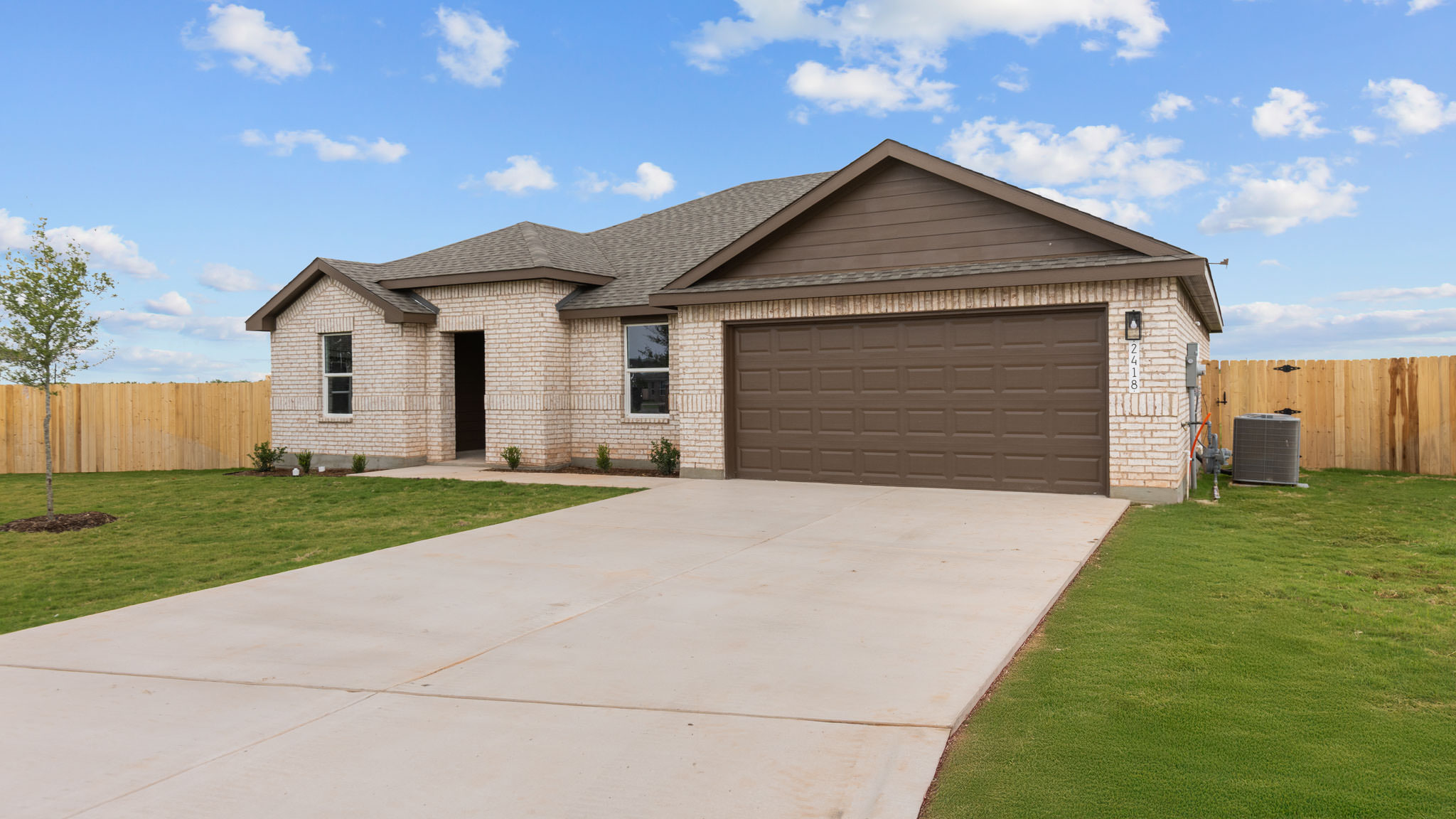 Side view of single story timeless brick home