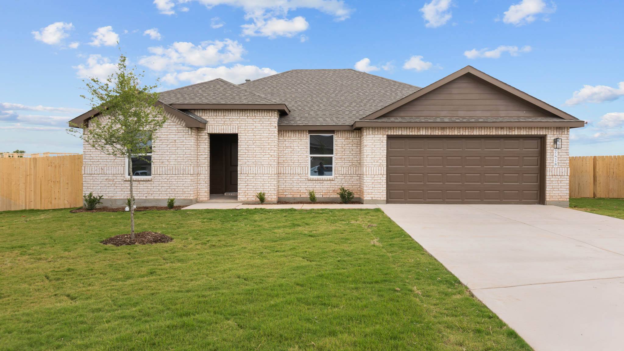 Exterior of single story modern brick style home