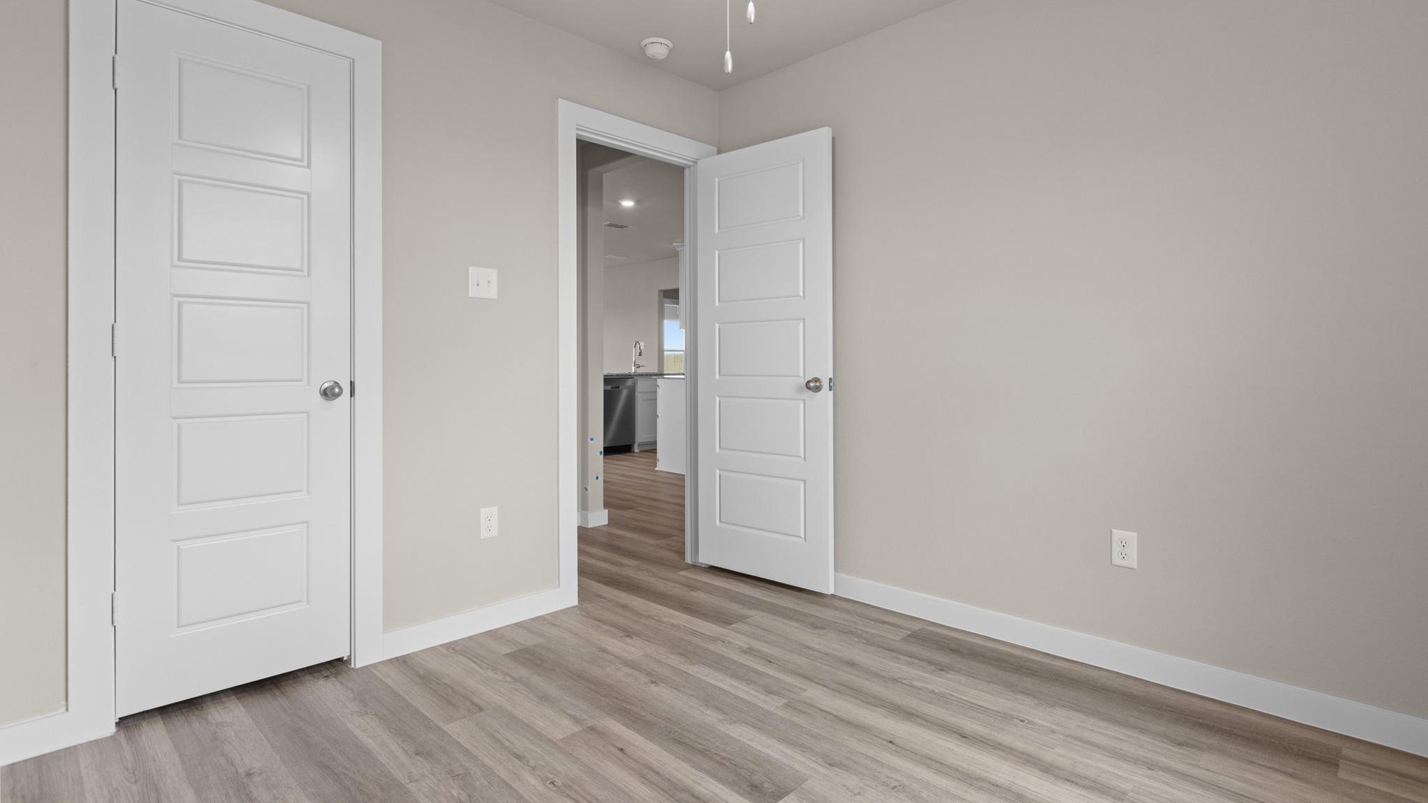 Guest bedroom 1 with front windows and ample natural light