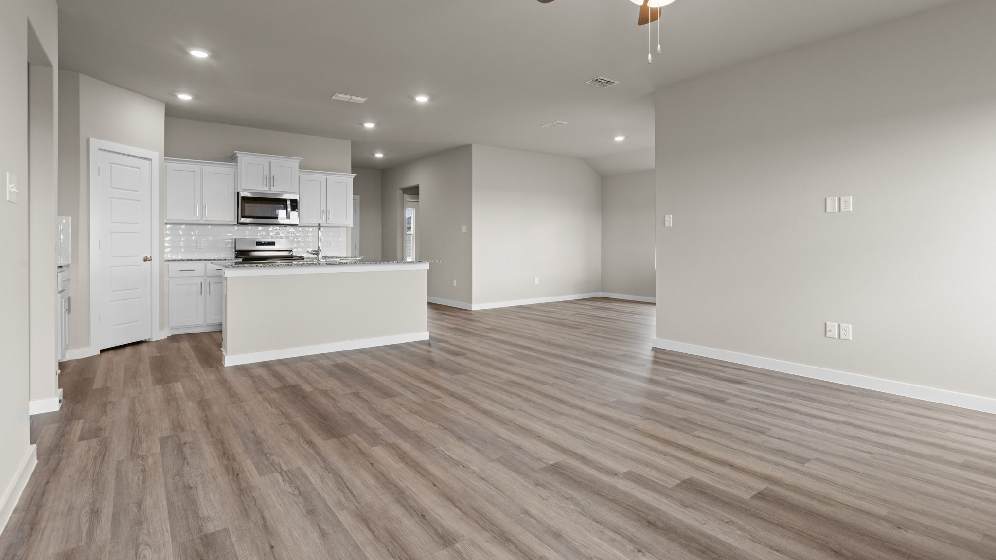 Open concept kitchen, living, family, and dining room space