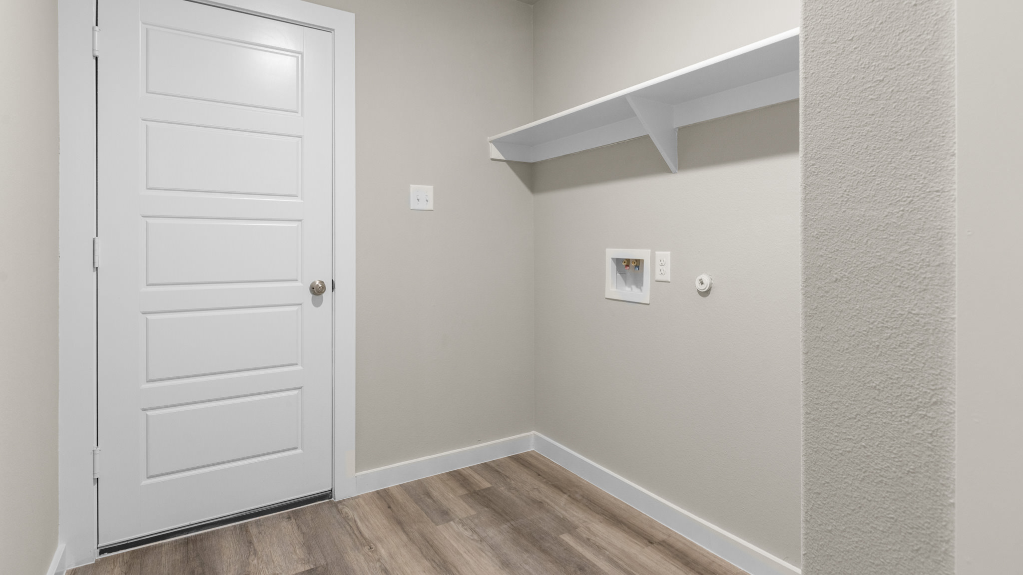 Laundry room and utility closet space with extra storage