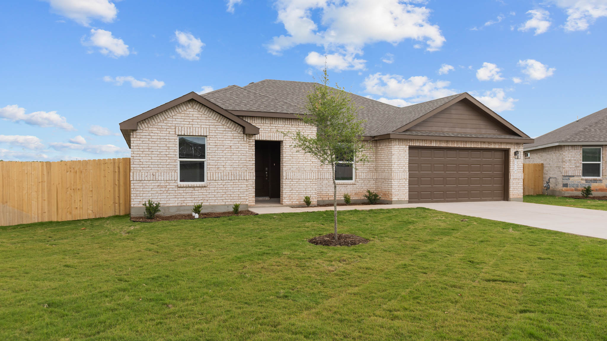 Single story classic brick home with front entry