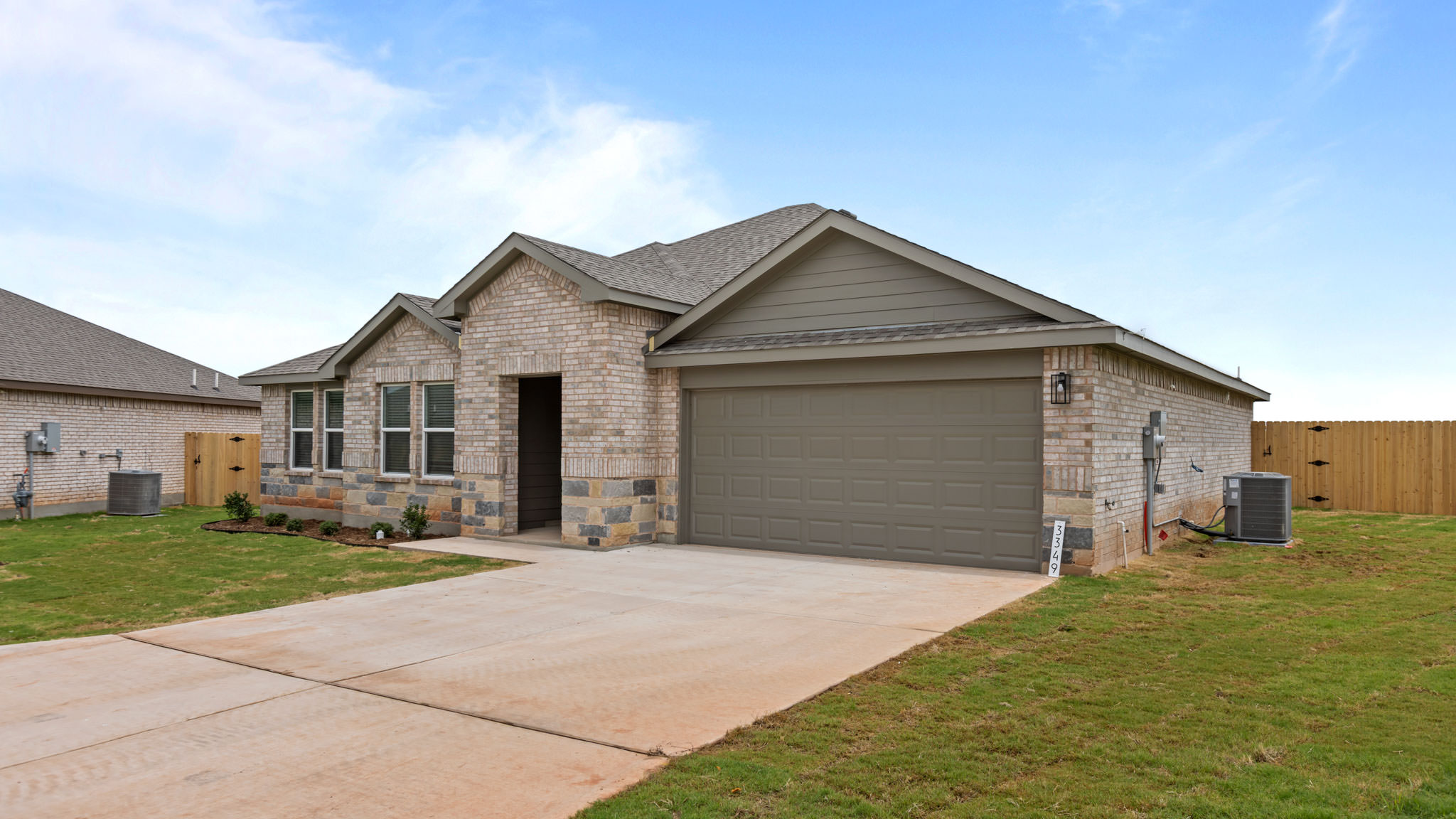 Side view of single story timeless brick home