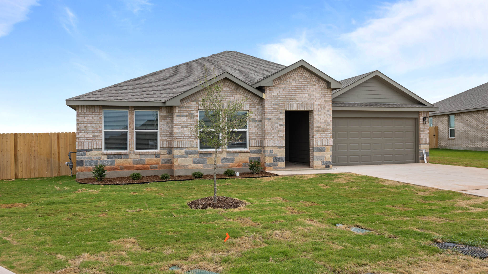 Single story classic brick home with front entry