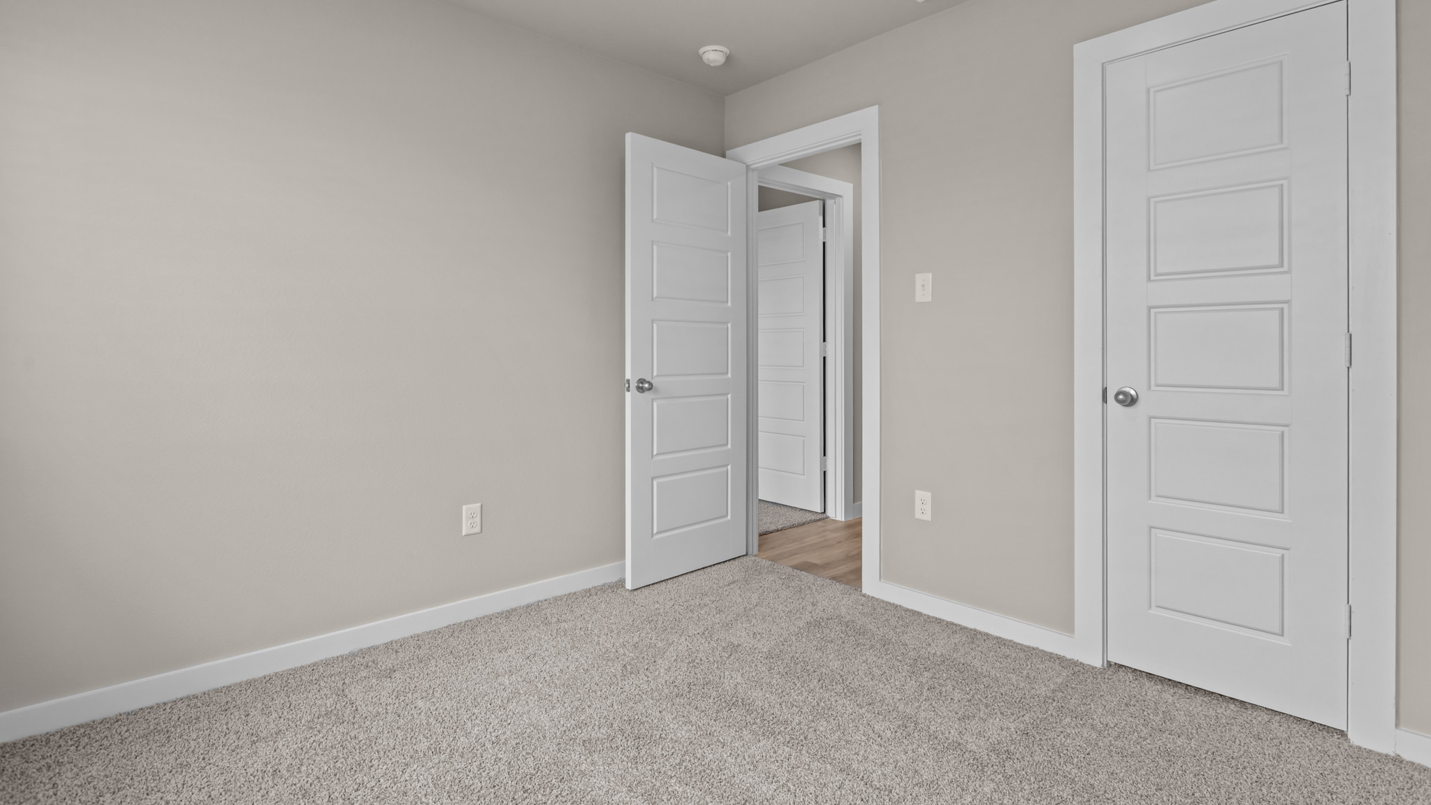 Guest bedroom 1 with front windows and ample natural light