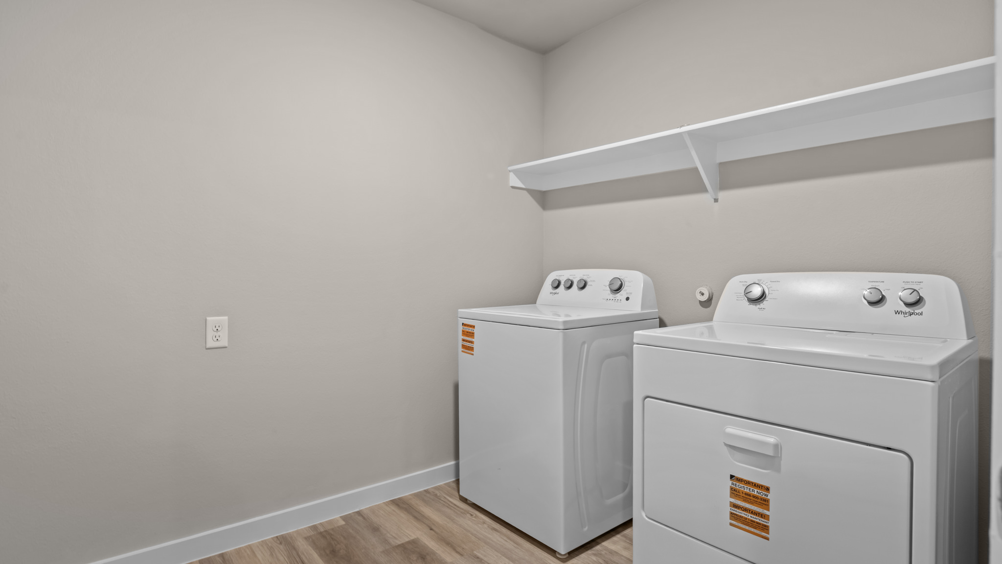 Laundry room and utility closet space with extra storage