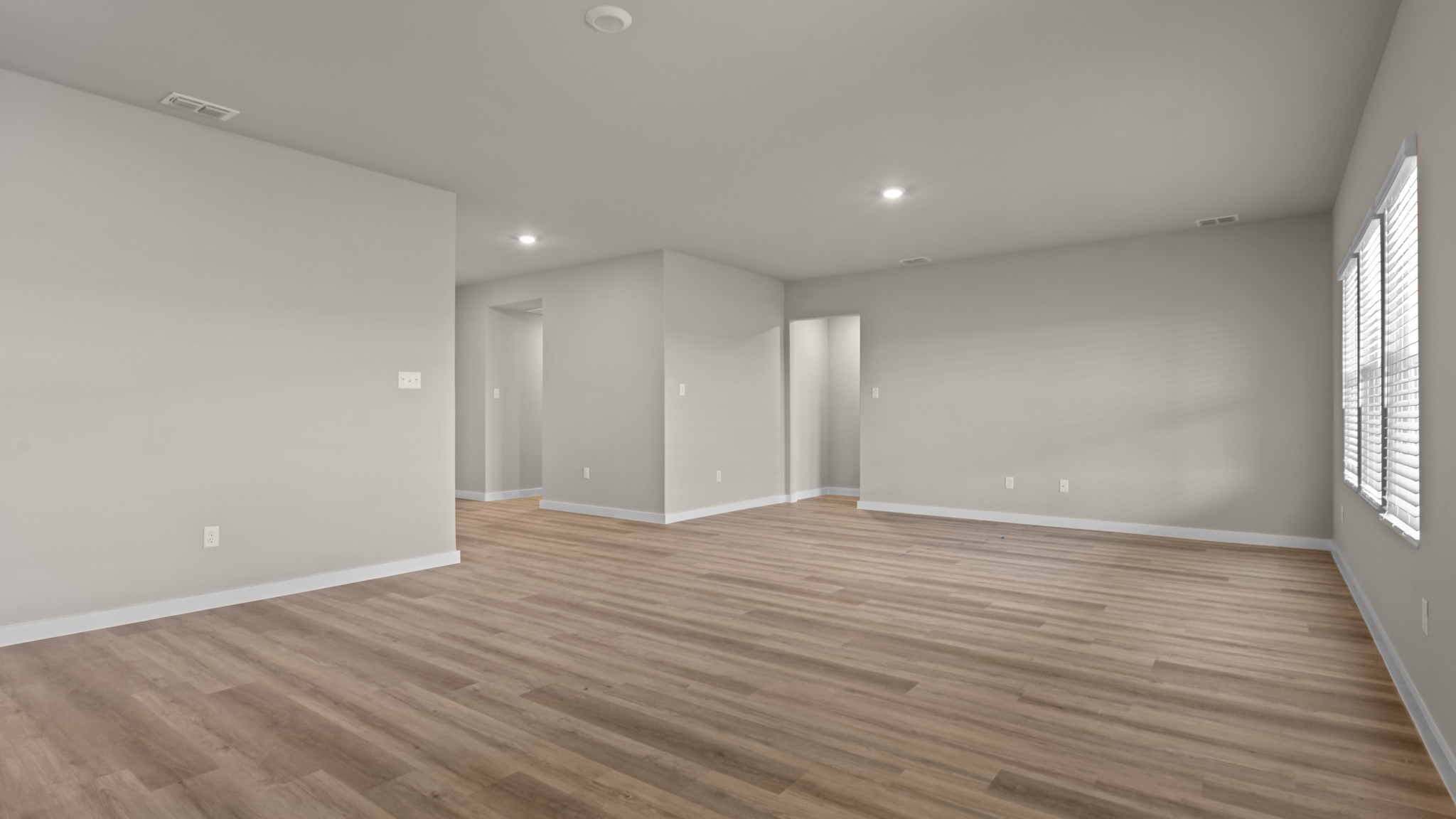 Open living and family room area with ample natural light