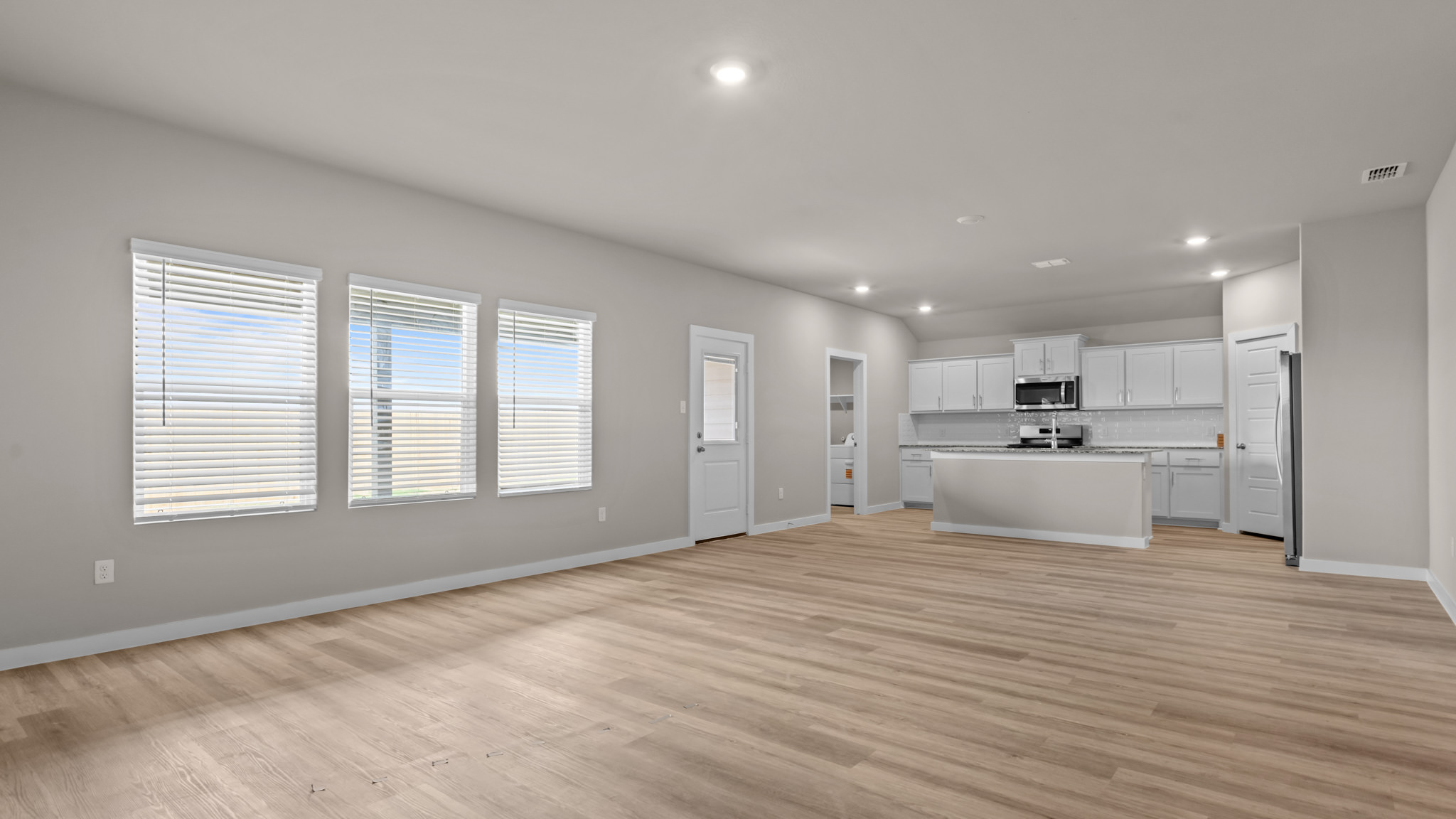 Open concept kitchen, living, family, and dining room space