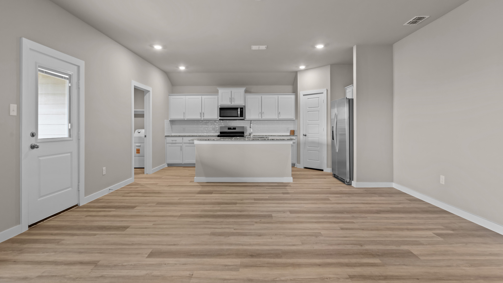 Open concept kitchen, living, family, and dining room space