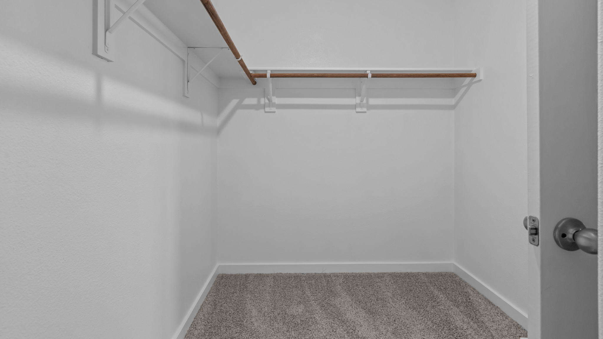 Primary walk-in closet with extra storage space