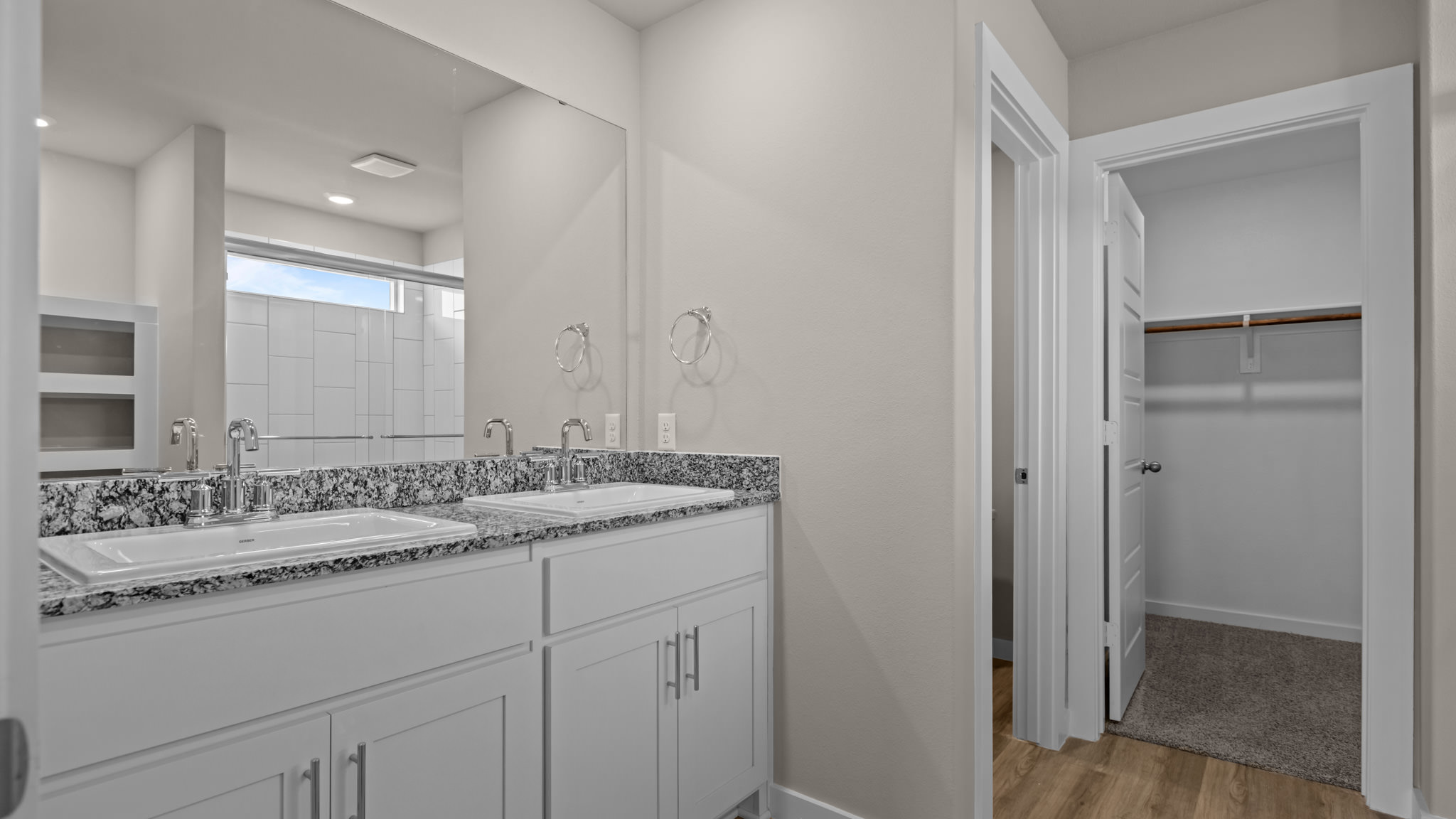 Private attached primary bathroom with built in vanity