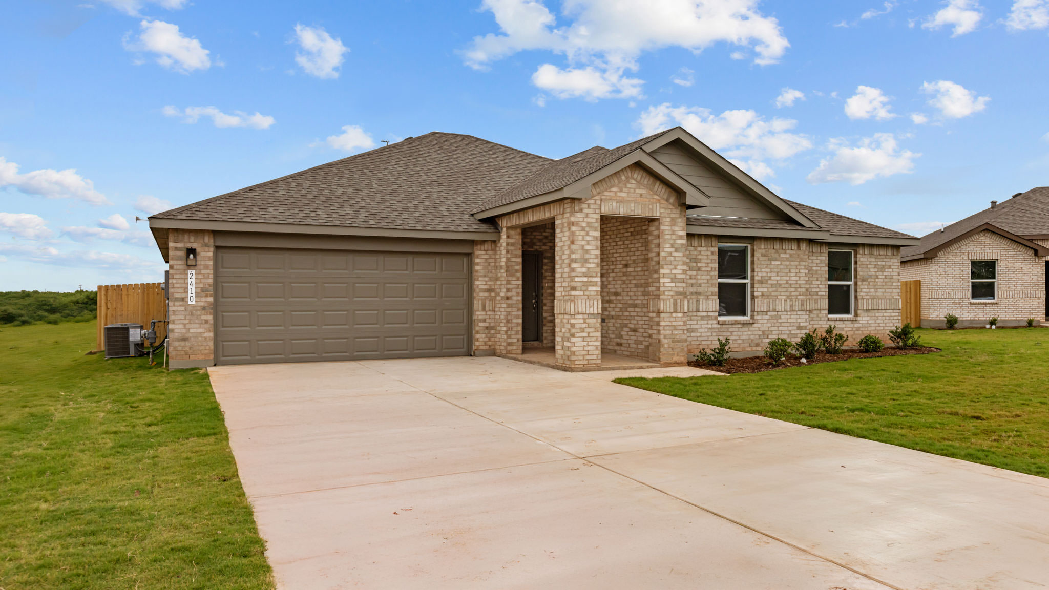 Side view of single story timeless brick home