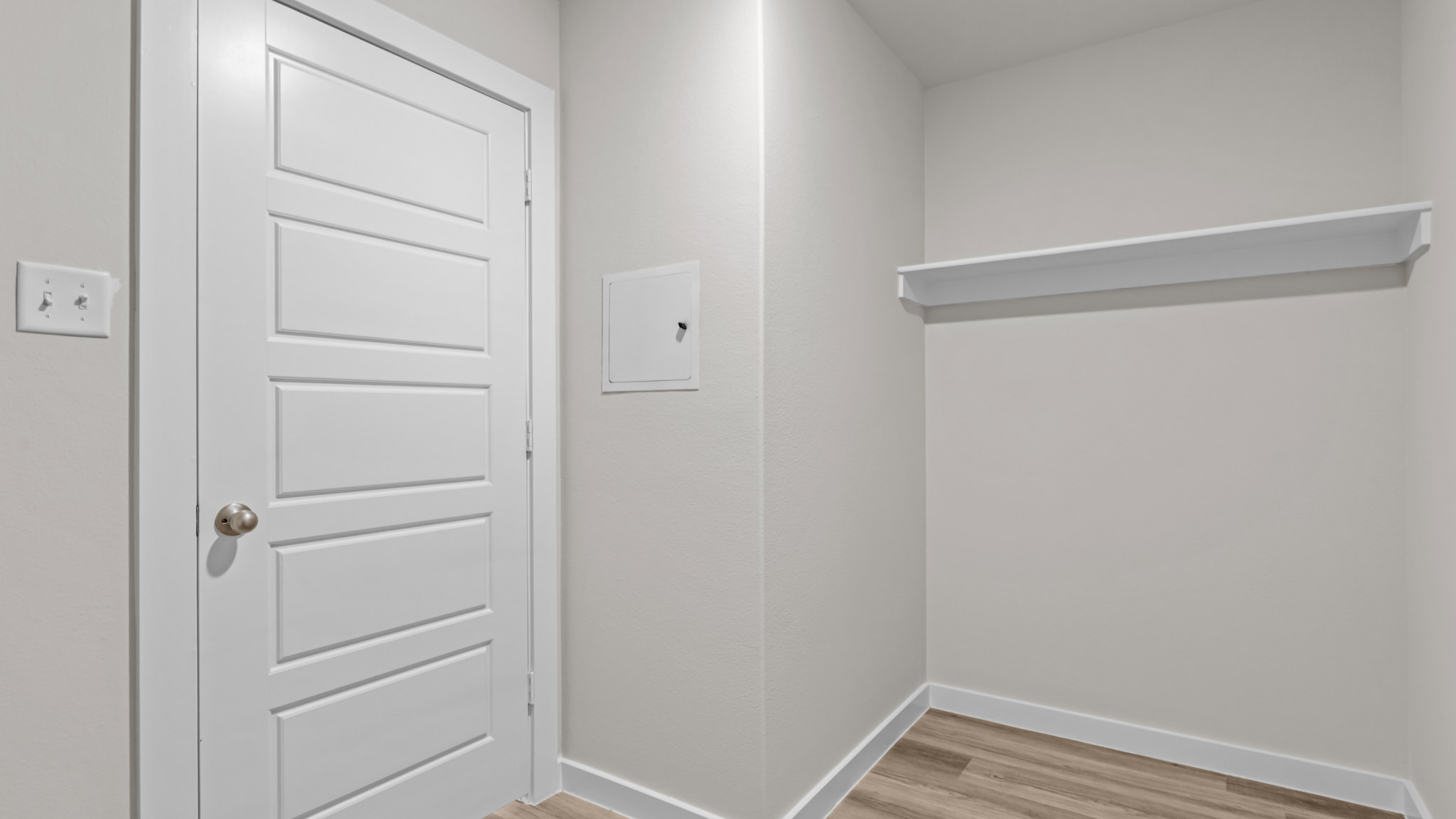 Laundry room and utility closet space with extra storage