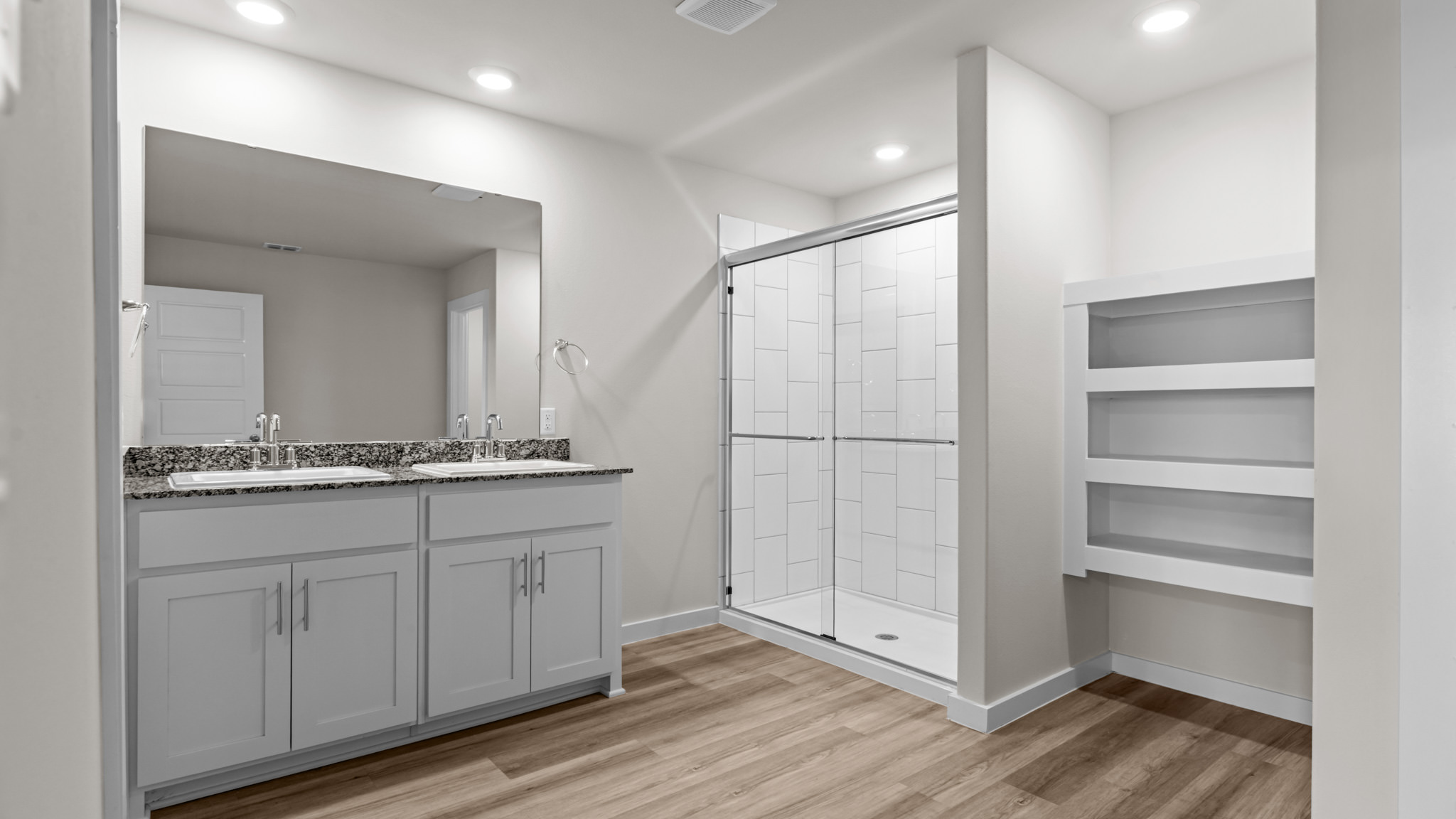 Private attached primary bathroom with built in vanity