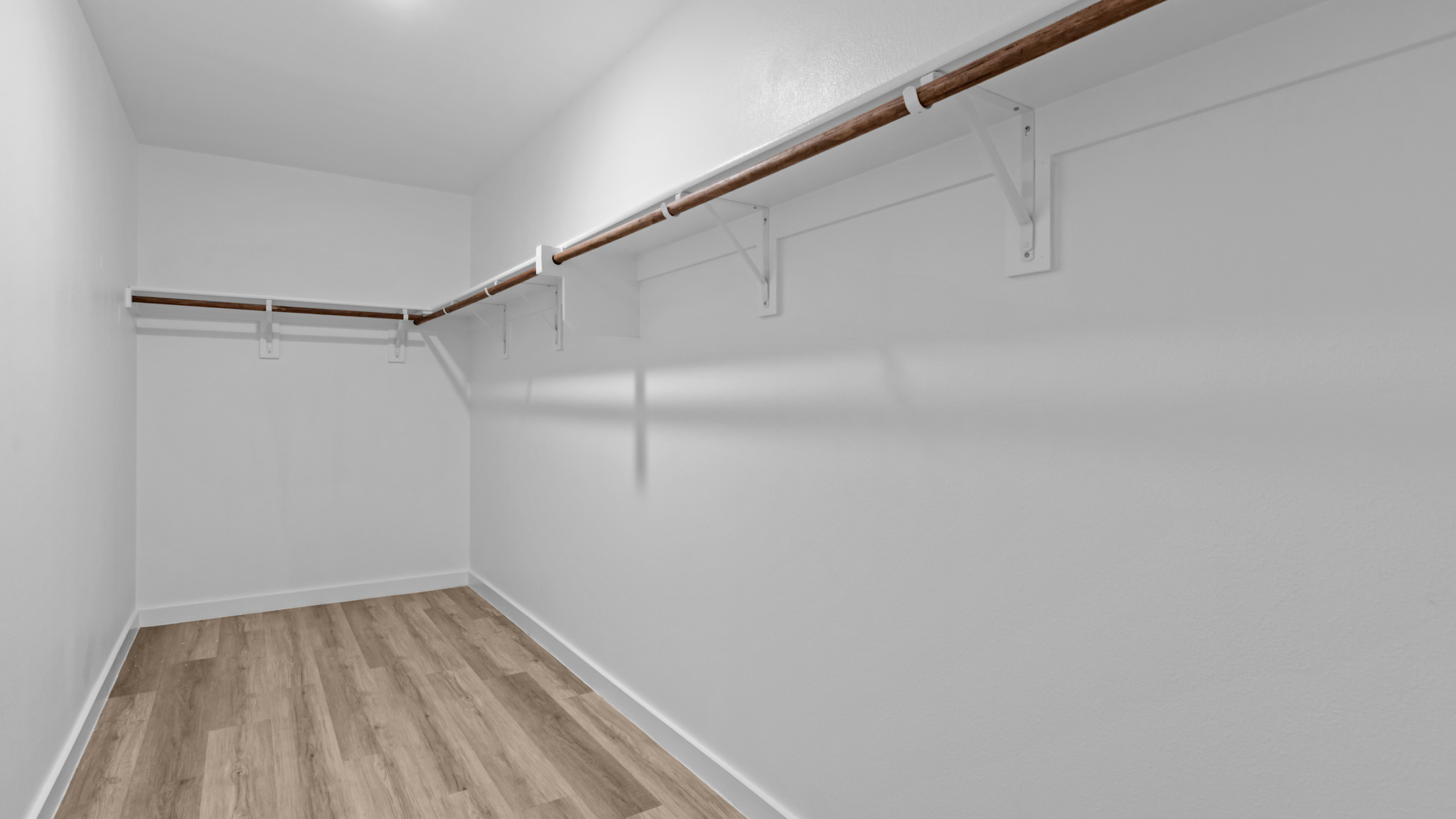 Primary walk-in closet with extra storage space