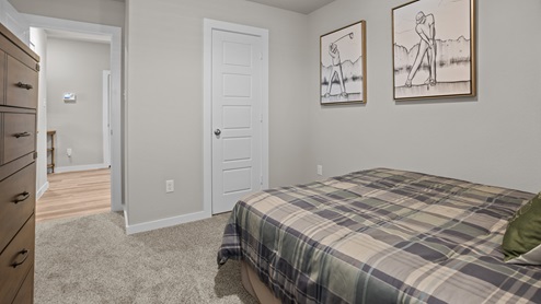Guest bedroom 1 with front windows and ample natural light
